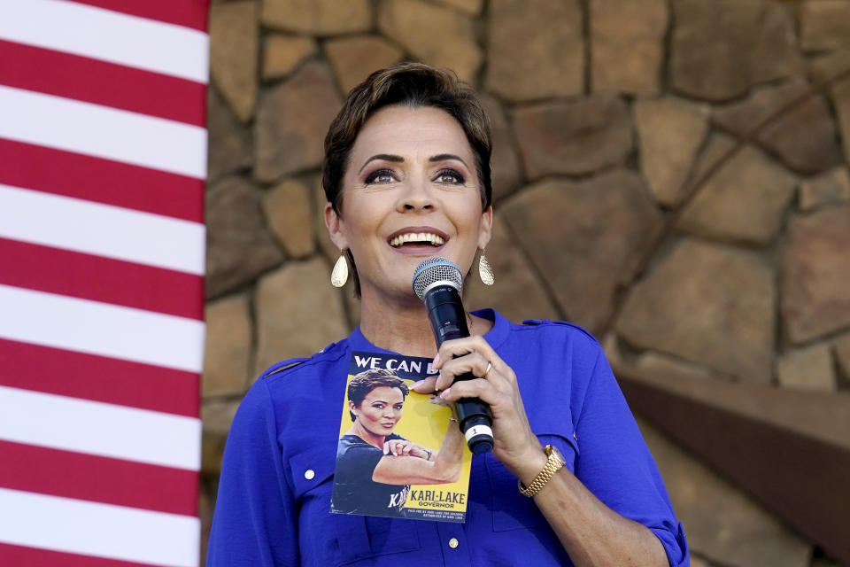 FILE - Republican gubernatorial candidate Kari Lake speaks to supporters at a campaign event in Queen Creek, Ariz., Oct. 5, 2022. Lake, the GOP candidate for governor, and Mark Finchem, the candidate for secretary of state, have refused to acknowledge their losses. Arizona counties will decide Monday, Nov. 28, whether to certify 2022 election results. (AP Photo/Ross D. Franklin)