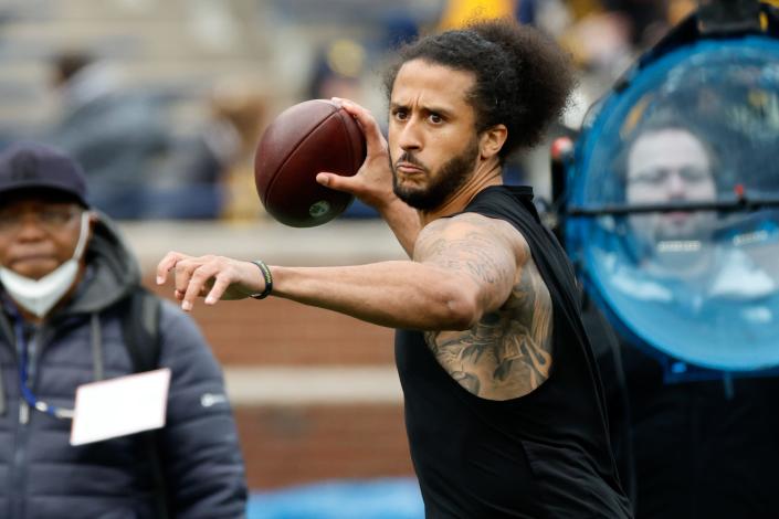 Colin Kaepernick passes during halftime at the 2022 Michigan Spring game at Michigan Stadium.