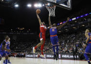 Washington Wizards forward Troy Brown Jr. (6), left, drives to the basket as New York Knicks guard Frank Ntilikina (11) defends, during an NBA basketball game between New York Knicks and Washington Wizards at the O2 Arena, in London, Thursday, Jan.17, 2019. (AP Photo/Alastair Grant)