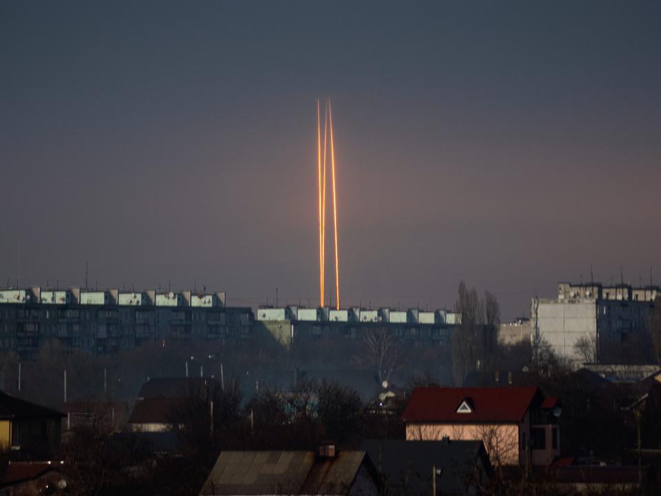 Three rockets launched against Ukraine from Russia's Belgorod region are seen at dawn in Kharkiv, Ukraine, Thursday, March 9, 2023.