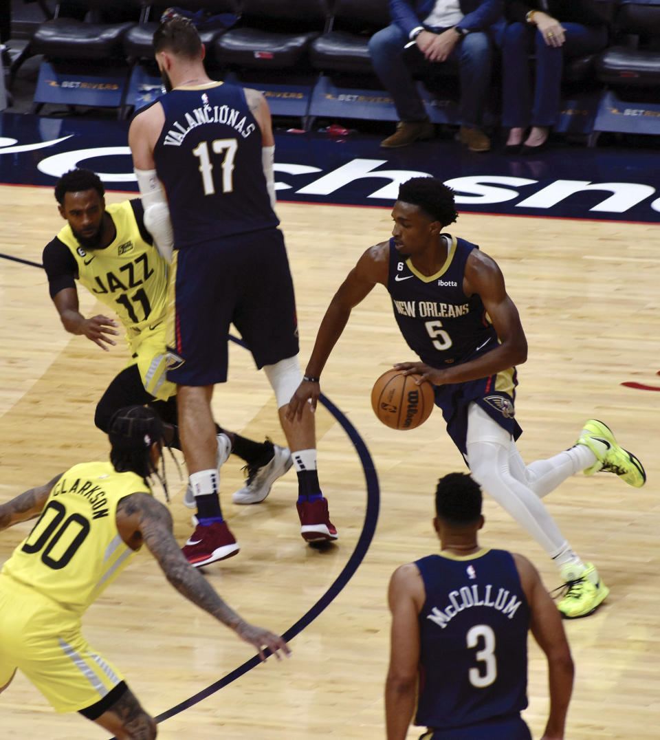 New Orleans Pelicans Guard Herb Jones (#5) dribbles the ball off a screen set by teammate Jonas Valanciunas (#17) against the Utah Jazz on Sunday, Oct. 23, 2022 at the Smoothie King Center in New Orleans. (Aimee Cronan/The Gazebo Gazette via AP)