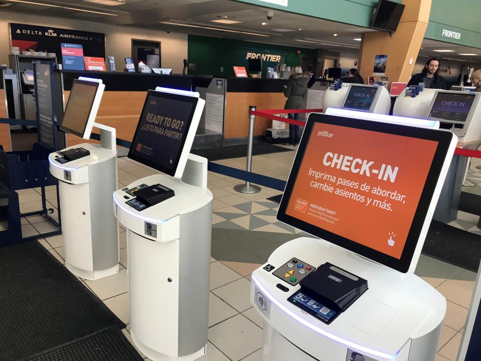 Empty check-in terminals at Burlington International Airport on Wednesday, March 18, 2020.