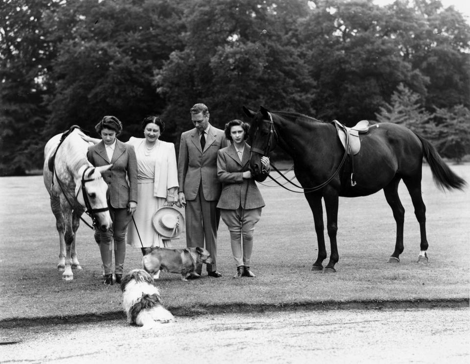 King George VI with his wife Elizabeth and his daughters Princess Margaret (1930 - 2002) and Princess Elizabeth