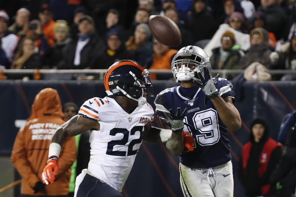 Dallas Cowboys' Amari Cooper (19) makes a touchdown reception against Chicago Bears' Kevin Toliver (22) during the second half of an NFL football game, Thursday, Dec. 5, 2019, in Chicago. (AP Photo/Charles Rex Arbogast)