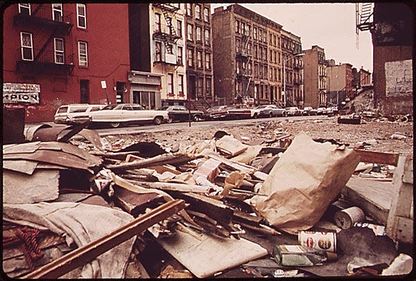 EMPTY LOT STREWN WITH TRASH AT 108TH STREET AND LEXINGTON AVENUE, MANHATTAN