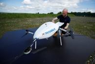 Drone operator from Manna Aero loads up essential household and medical supplies for delivery in Moneygall