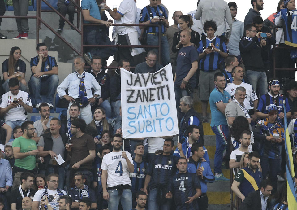 Fans show banners prior to the start of the Serie A soccer match between Inter Milan and Lazio at the San Siro stadium in Milan, Italy, Saturday, May 10, 2014. (AP Photo/Antonio Calanni)