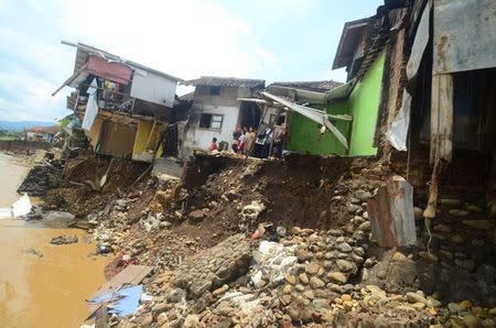 A view of the damage caused after the Cimanuk River overflowed from heavy rains in Garut, West Java, Indonesia September 21, 2016 in this photo taken by Antara Foto. Antara Foto/Adeng Bustomi/ via REUTERS