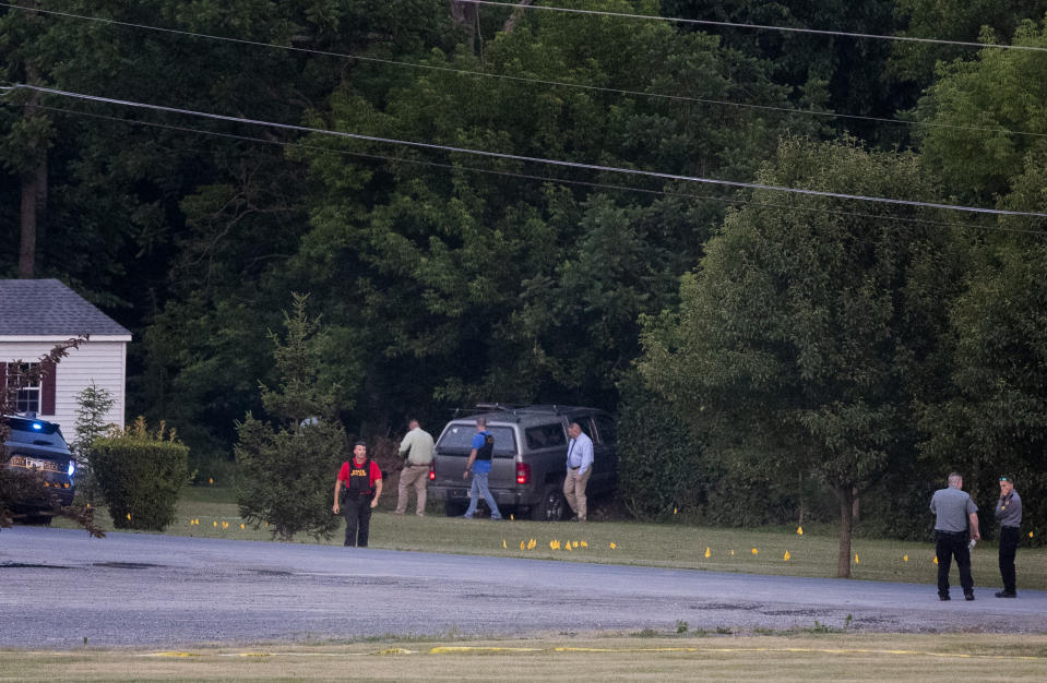 Authorities gather at the scene of a shootout between Pennsylvania State Troopers and a gunman near Mifflintown, Pa., Saturday, June 17, 2023. (Sean Simmers/The Patriot-News via AP)