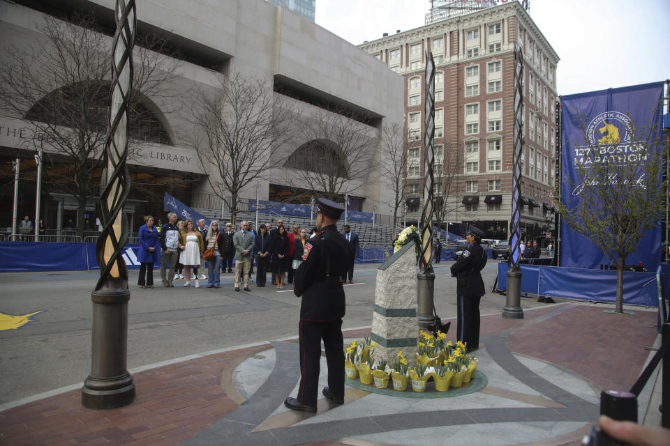 One of two memorials is flanked by emergency responders during gathering for victims of the 2013 Boston Marathon bombing, Saturday April 15, 2023, in Boston. (AP Photo/Reba Saldanha)