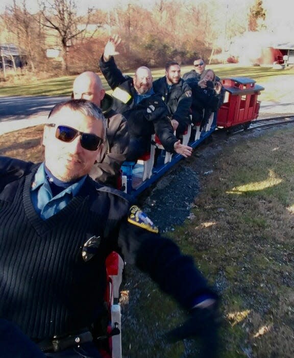 Members of the Washington Township Police Department take a ride on the Red Run Express.