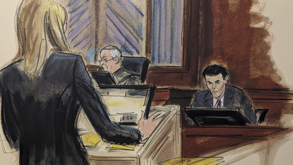 In this courtroom sketch, FTX founder Sam Bankman-Fried, right, is cross-examined by Assistant US Attorney Danielle Sassoon, left, in Manhattan federal court, Thursday, Oct. 26, 2023, in New York. (Elizabeth Williams via AP)