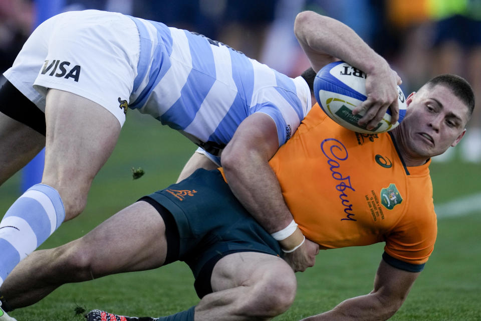 Australia's James O'Connor, right, is tackled by Argentina's Emiliano Boffelli, during their Rugby Championship match at the Bicentenario stadium in San Juan, Argentina, Saturday, Aug. 13, 2022. (AP Photo/Natacha Pisarenko)