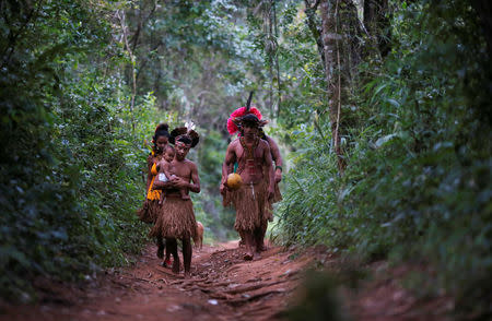 Indigenous people from the Pataxo Ha-ha-hae tribe walk to Paraopeba river, after a tailings dam owned by Brazilian mining company Vale SA collapsed, in Sao Joaquim de Bicas near Brumadinho, Brazil January 28, 2019. REUTERS/Adriano Machado