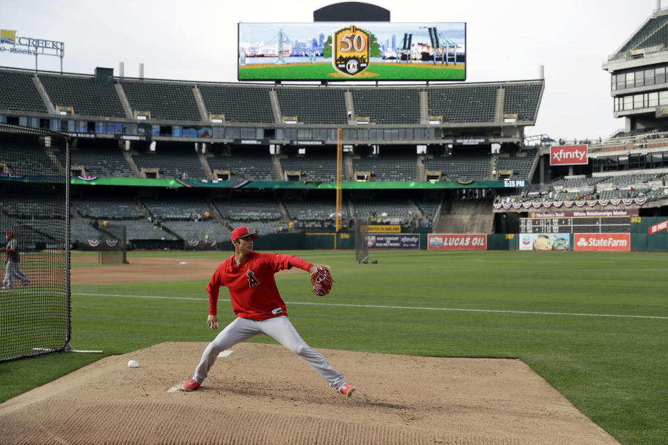 Los Angeles Angels pitcher Shohei Ohtani throws a bullpen session before a baseball game against the Oakland Athletics. (AP)