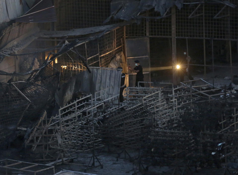 <p>Police officers search the body on the site of an explosion at a firecracker factory in Tangerang, on the outskirts of Jakarta, Indonesia, Thursday, Oct. 26, 2017. (Photo: Tatan Syuflana/AP) </p>