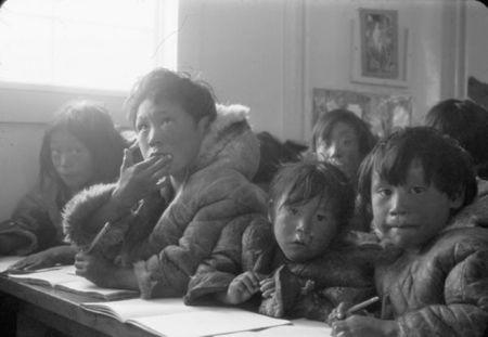 Students are seated at their desks in a classroom at the Eskimo Point Federal Hostel in Arviat, Nunavut in an undated archive photo. REUTERS/D.B. Marsh/Library and Archives Canada/e007914491/handout