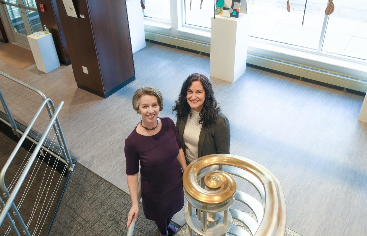 Lansing Art Gallery and Education Center Executive Director Barb Whitney, left, poses for a portrait with Education Director Michelle Carlson, Tuesday, March 29, 2022, at the Lansing Art Gallery.  Carlson will become acting director April 1, when Whitney leaves for her new role as associate director of development for cultural arts at Michigan State University.