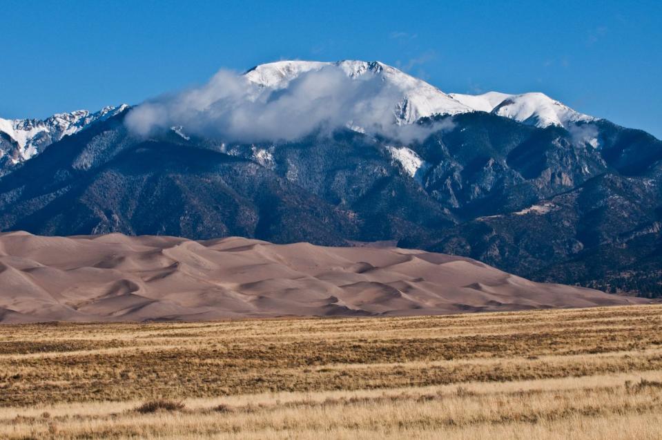 <p>Think of the <a href="https://www.nps.gov/grsa/index.htm" rel="nofollow noopener" target="_blank" data-ylk="slk:Great Sand Dunes National Park;elm:context_link;itc:0;sec:content-canvas" class="link ">Great Sand Dunes National Park</a> in Colorado as an extremely sandy beach. The selling point of this underrated spot is the springtime when the Medano Creek floods. The waters go down into the San Luis Valley and turn the dunes into a temporary lake completely with waves. The park features the tallest sand dunes in North America, as well as snow at its highest peak. </p>