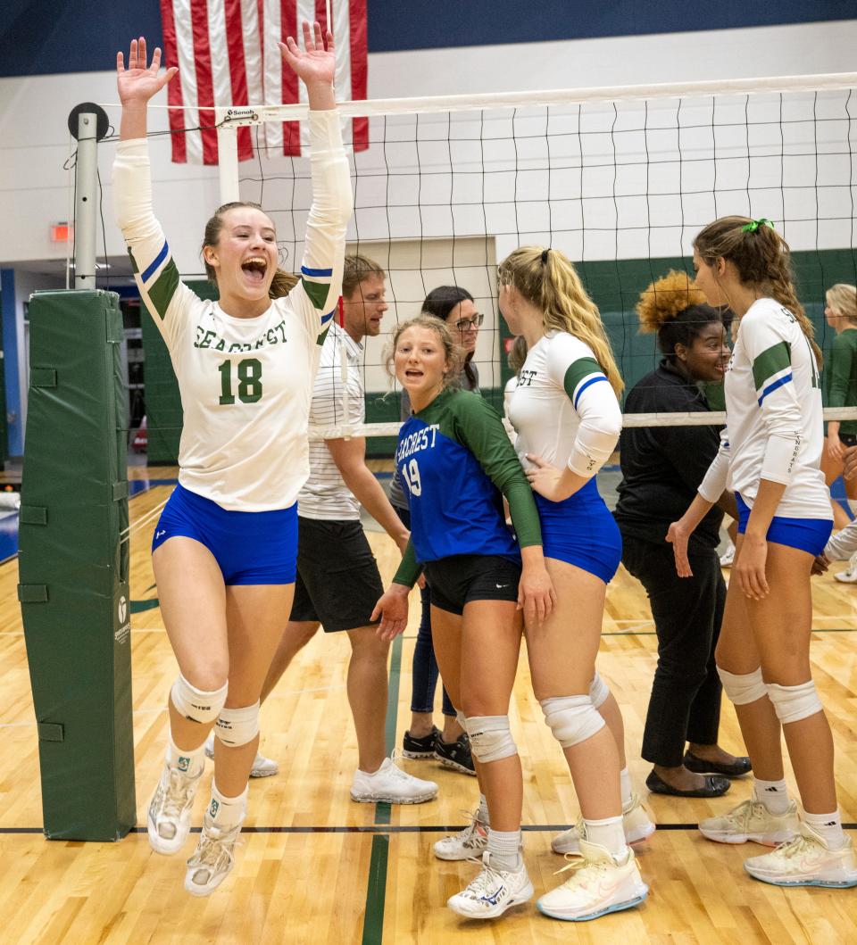 Brooke Spurgeon of Seacrest, left, celebrates the teamÕs victory over Keswick Christian in the regional championship match at Seacrest Country Day School Tuesday evening, November 1, 2022, in Naples.