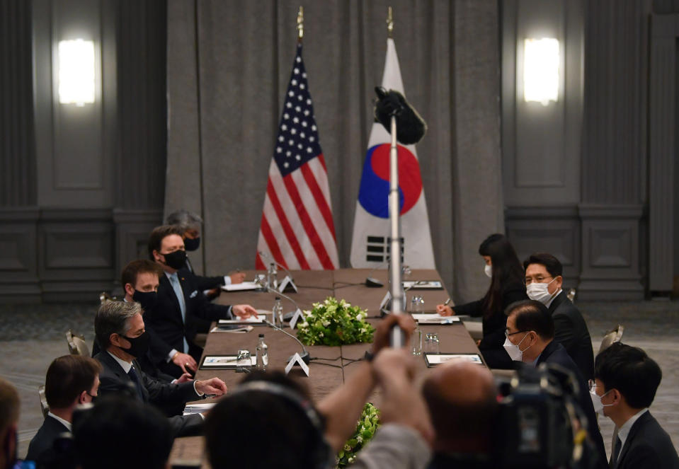 United States Secretary of State Antony Blinken, second left, wearing a face mask to curb the spread of coronavirus, speaks to South Korea's Foreign Minister Chung Eui-yong, third right, during bilateral talks on the sidelines of a G7 foreign ministers meeting, at the Grosvenor House Hotel, London, Monday, May 3, 2021. (Ben Stansall/Pool Photo via AP)