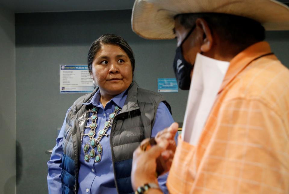 Navajo Nation presidential candidate Emily Ellison meets with a voter after the presidential candidate forum on June 3 at San Juan College in Farmington.