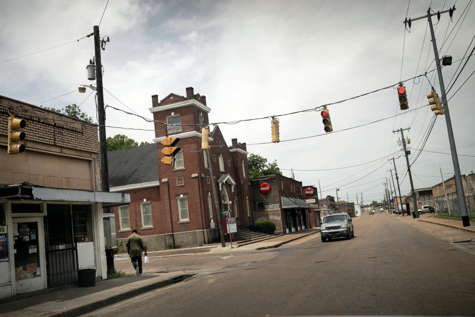 A man walks down a quiet street in downtown Greenwood, Miss., Tuesday, June 11, 2019. The city was a flashpoint for voter registration drives in the 1960s. (AP Photo/Wong Maye-E)