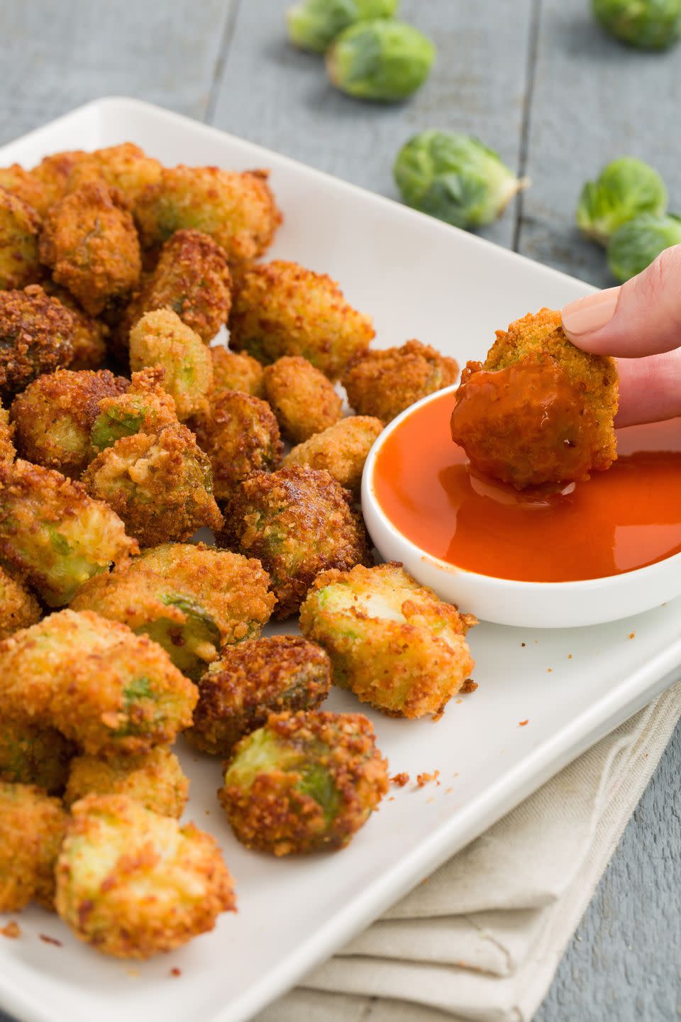 <p>Even if you hate vegetables, you won't be able to stop eating these highly addictive (and totally disguised) <a href="https://www.delish.com/cooking/recipe-ideas/recipes/a51133/classic-buffalo-wings-recipe/" rel="nofollow noopener" target="_blank" data-ylk="slk:Buffalo wing;elm:context_link;itc:0;sec:content-canvas" class="link ">Buffalo wing</a>-inspired <a href="https://www.delish.com/cooking/g1409/brussels-sprouts-recipes" rel="nofollow noopener" target="_blank" data-ylk="slk:Brussels sprouts;elm:context_link;itc:0;sec:content-canvas" class="link ">Brussels sprouts</a>. Serve with extra buffalo sauce or <a href="https://www.delish.com/cooking/recipe-ideas/a38768697/blue-cheese-dressing-recipe/" rel="nofollow noopener" target="_blank" data-ylk="slk:blue cheese dressing;elm:context_link;itc:0;sec:content-canvas" class="link ">blue cheese dressing</a> FTW.</p><p>Get the <a href="https://www.delish.com/holiday-recipes/thanksgiving/recipes/a44804/buffalo-brussels-sprouts/" rel="nofollow noopener" target="_blank" data-ylk="slk:Buffalo Brussels Sprouts recipe;elm:context_link;itc:0;sec:content-canvas" class="link "><strong>Buffalo Brussels Sprouts recipe</strong></a>.</p>