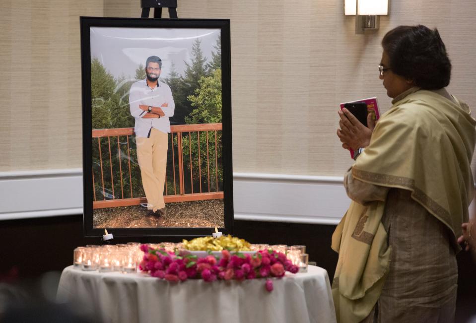 Kailash Sharma, a priest from the Hindu Temple, prays for Prudhvi Kandepi during his memorial service at The Ramada Plaza in Sharonville. Kandepi, 25, was the youngest victim in the mass shooting Thursday, September 6, in the lobby of the Fifth Third Center on Fountain Square. He was an electrical engineer and contract worker at the bank. Omar Santa Perez, 29, opened fire Thursday morning, killing three and wounding two others. Police shot and killed Santa. Kandepi body is being flown home to India for funeral services. 