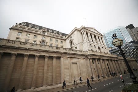 People walk past the Bank of England in London, Britain, October 17, 2017. REUTERS/Hannah McKay