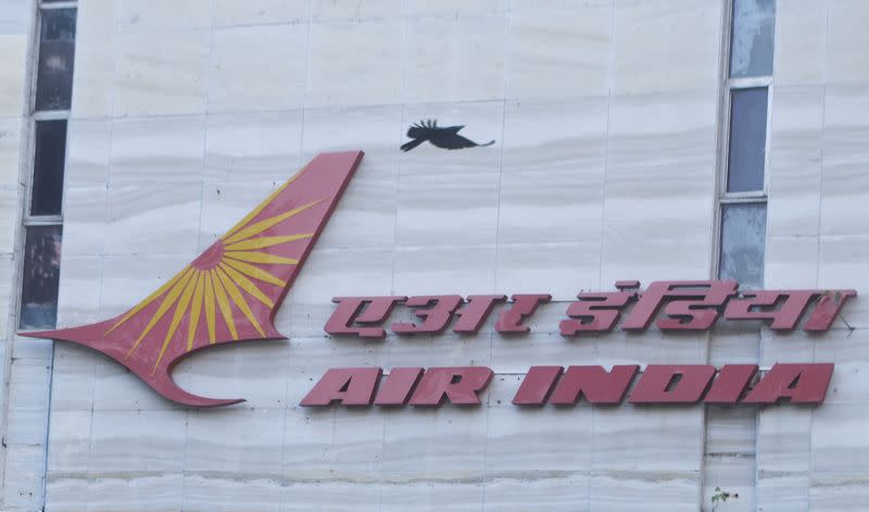 FILE PHOTO: A bird flies over a logo of Air India airlines at the corporate headquarters in Mumbai