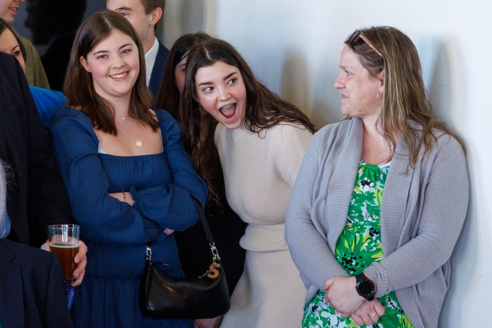 Danica Dandridge, center, reacts to finding out the "surprise birthday" was a surprise wedding ceremony, Friday, March 29, 2024, at Wynridge Farms in York Township.