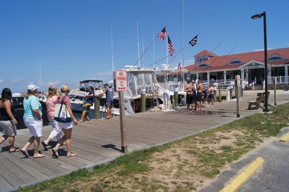 Boats are docked on a pier near Ballard's on Block Island.