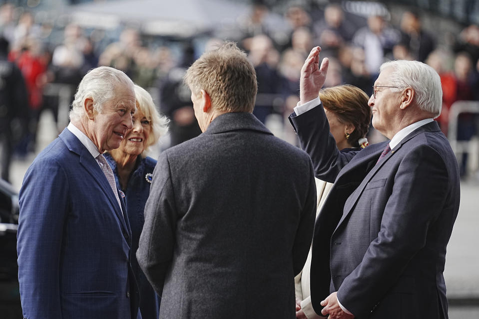 Britain's King Charles III, left, and Camilla Queen Consort say goodbye to German President Frank-Walter Steinmeier right, his wife Elke Buedenbender and Richard Lutz (from back), Chairman of the Board of Management of Deutsche Bahn AG at Berlin Central Station in Berlin, Germany, Friday, March 31, 2023. At the end of their three-day trip to Germany, Britain's King Charles III and Camilla Queen Consort visit the Hanseatic city of Hamburg. (Kay Nietfeld/dpa via AP)