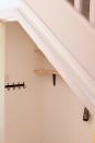 <p>Affix the rest of your wall-mounted storage if any – Jen added a handy row of hooks.</p><p>Read more: <a href="https://www.housebeautiful.com/uk/lifestyle/storage/g39924030/storage-ideas/" rel="nofollow noopener" target="_blank" data-ylk="slk:Storage ideas to banish clutter for good;elm:context_link;itc:0;sec:content-canvas" class="link ">Storage ideas to banish clutter for good</a> </p>