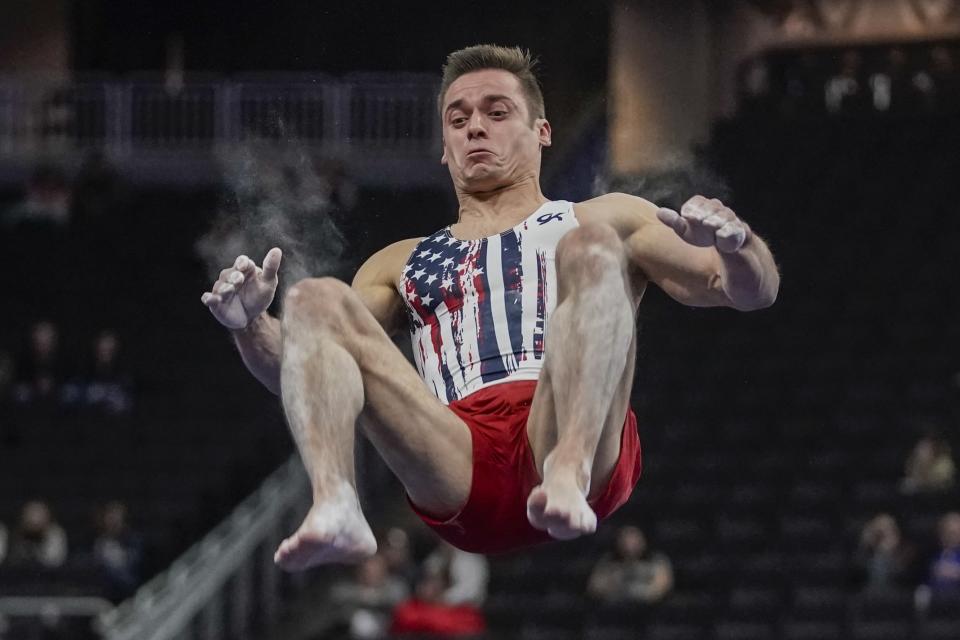Sam Mikulak of the United States performs on the floor during the American Cup gymnastics competition Saturday, March 7, 2020, in Milwaukee. (AP Photo/Morry Gash)