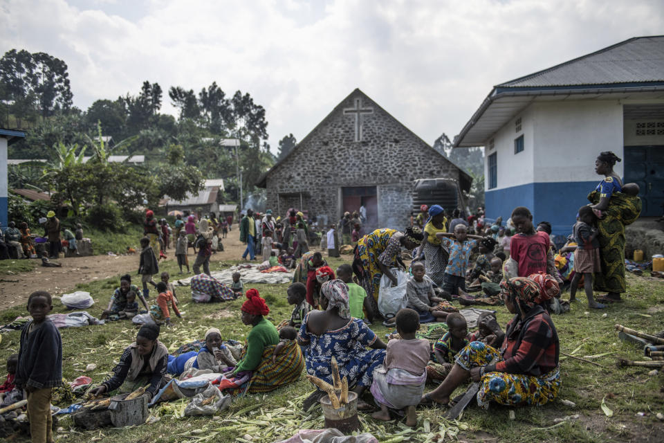 People fleeing the fighting between M23 forces and Congolese army find refuge in a church in Kibumba, north of Goma, Democratic Republic of Congo, Friday Jan. 28, 2022. In the past week, inhabitants from six villages in the country's east – including, Bukima, Nyesisi, and Ruhanga – have fled the violence. At least 2,000 people are now living in improvised shelters, in churches, schools or with host families. (AP Photo/Moses Sawasawa)