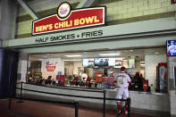 Ben's Chili Bowl stand at Nationals Park in Washington before an exhibition baseball game between the Washington Nationals and the Washington Nationals Futures, Tuesday, March 26, 2024. Most parks and arenas have a handful of areas that offer salads, gluten free or vegan offerings if fans are willing to hunt a little. But the vast majority of people attending baseball games aren't necessarily looking to eat healthy. (AP Photo/Nick Wass)