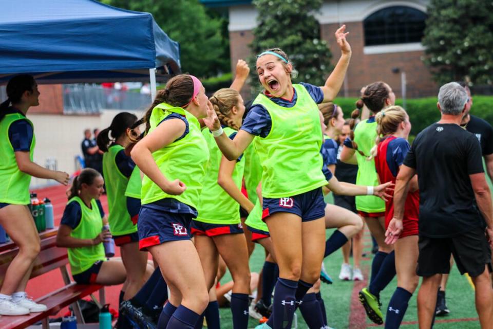 Providence day players jump for joy after securing their Championship Win at the NCISAA girls soccer finals at Providence Day