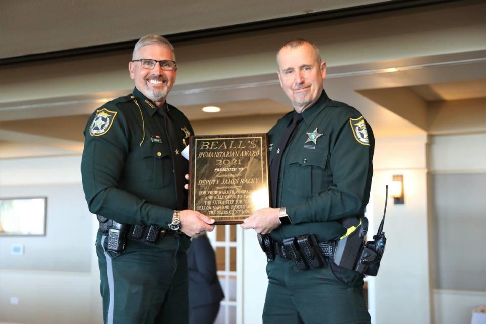 Manatee County Sheriff Rick Wells with Bealls Humanitarian of the Year award winner Deputy James Racky, for his work with Parrish United Methodist Church’s Food Pantry Ministry.