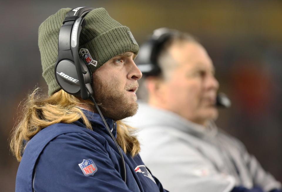 Patriots assistant coach Steve Belichick on the sideline with his boss, and father, nearby.