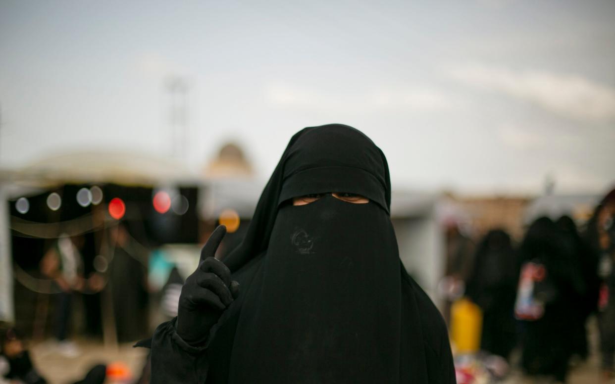 File image of a woman posing for a portrait at Al-Hol camp, which holds families of Islamic State members, near Hasakeh, Syria - AP