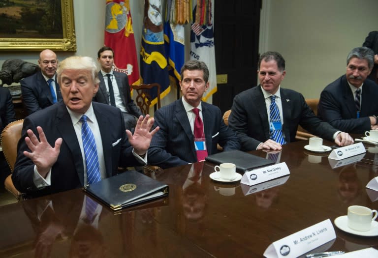 US President Donald Trump (L) meets with business leaders in the Roosevelt Room at the White House on January 23, 2017