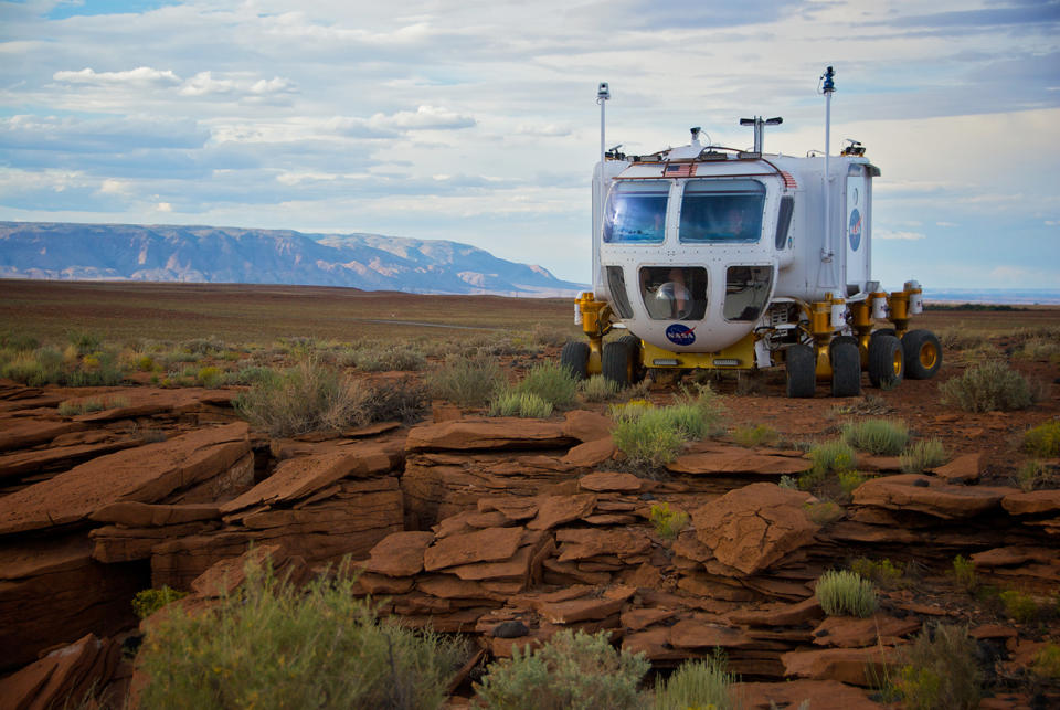 As part of NASA's Desert Research and Technology Studies (RATS), astronauts learn to drive a land-based Space Exploration Vehicle (SEV) over sparse terrain.
