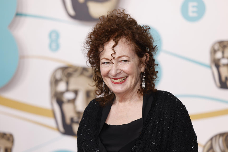 Nan Goldin poses for photographers upon arrival at the 76th British Academy Film Awards, BAFTA's, in London, Sunday, Feb. 19, 2023. (Photo by Vianney Le Caer/Invision/AP)