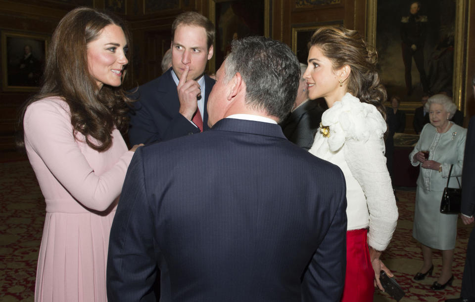 Queen Elizabeth II, right, looks on as the Duke and Duchess of Cambridge chat with King Hussein and Queen Rania of Jordan as guests arrive at a lunch for sovereign monarchs of the world, held in honour of the queen's Diamond Jubilee, at Windsor Castle, in Windsor, Friday May 18, 2012. Critics are aghast at the choice of some guests for the lunch _ among them a king whose Gulf nation has been engaged in a brutal crackdown on political dissent. (AP Photo/ Arthur Edwards, Pool)