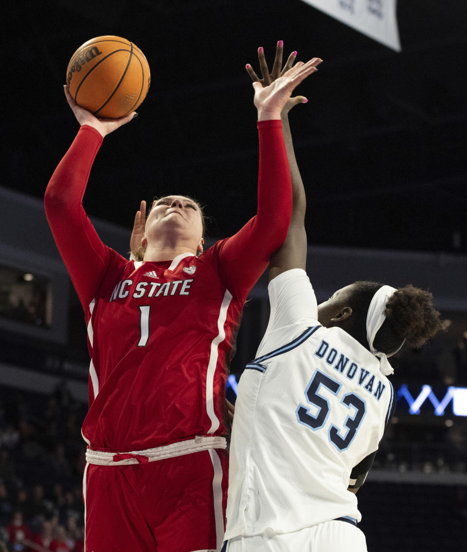 North Carolina State center River Baldwin (1) shoots against Old Dominion forward Lanetta Williams (53) during the first half of an NCAA college basketball game Wednesday, Dec. 20, 2023, in Norfolk, Va. (AP Photo/Mike Caudill)