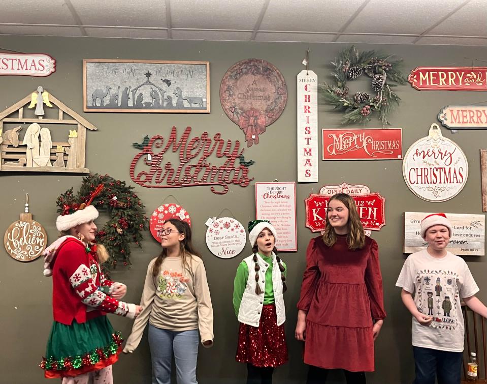 Mansfield Youth Theater Choreographer Cassandra Kurek (left) said they came to Bucyrus Christmas celebrations to carol. They first did it last year, and it becamea tradition.