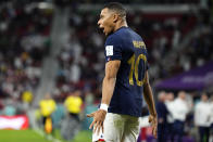 France's Kylian Mbappe celebrates scoring his side's third goal during the World Cup round of 16 soccer match between France and Poland, at the Al Thumama Stadium in Doha, Qatar, Sunday, Dec. 4, 2022. (AP Photo/Martin Meissner)