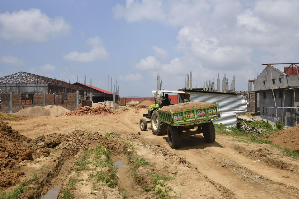 This Aug.29, 2019 photo, shows under-construction buildings intended to function as detention center for people who are not included in the National Register of Citizens, (NRC) in Kadamtola Gopalpur village, in Goalpara district, in Assam, India. Nearly 2 million people, about half Hindu and half Muslim, were excluded from NRC, an official list of citizens and have been asked to prove their citizenship or else be considered foreign. India is building the detention center for some of the tens of thousands of people who the courts are expected to ultimately determine have entered illegally. (AP Photo)